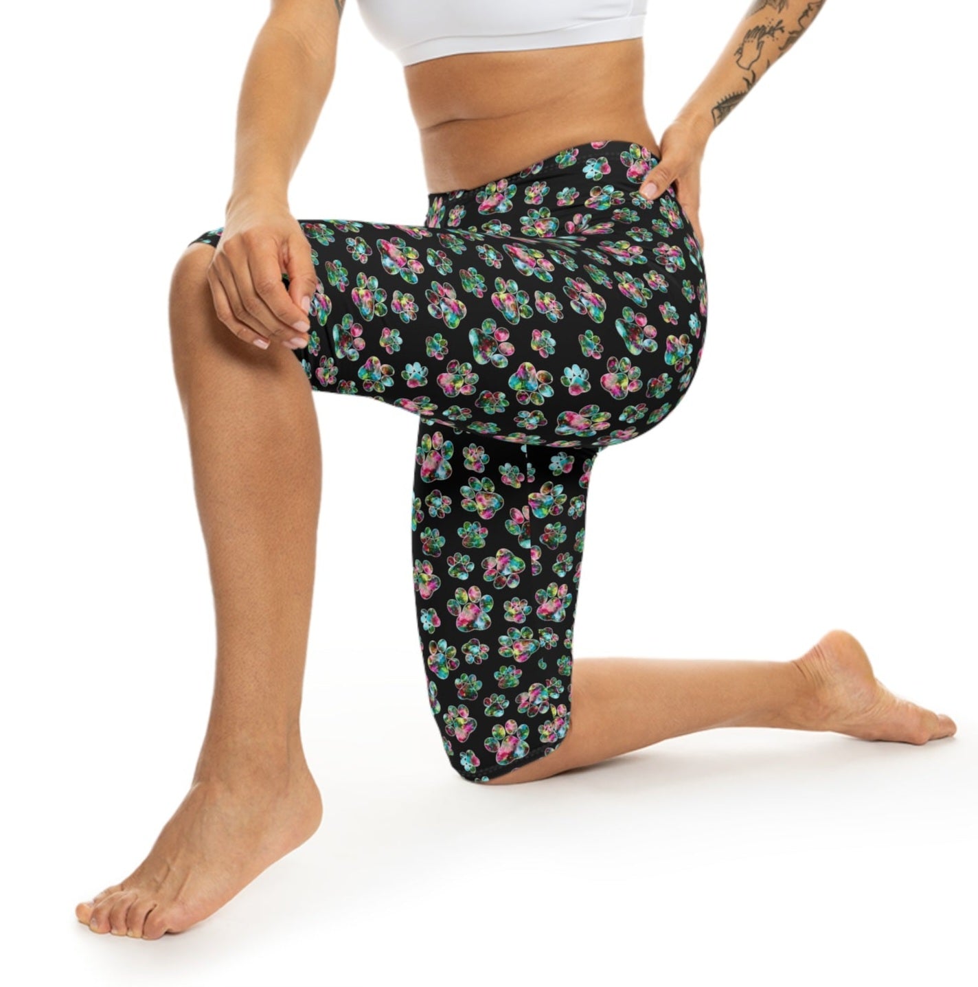 Model in action wearing Angel Paws Capri Leggings by Alisa Marie. Colorful paw prints design, perfect for spring and summer fitness, yoga, or casual wear.