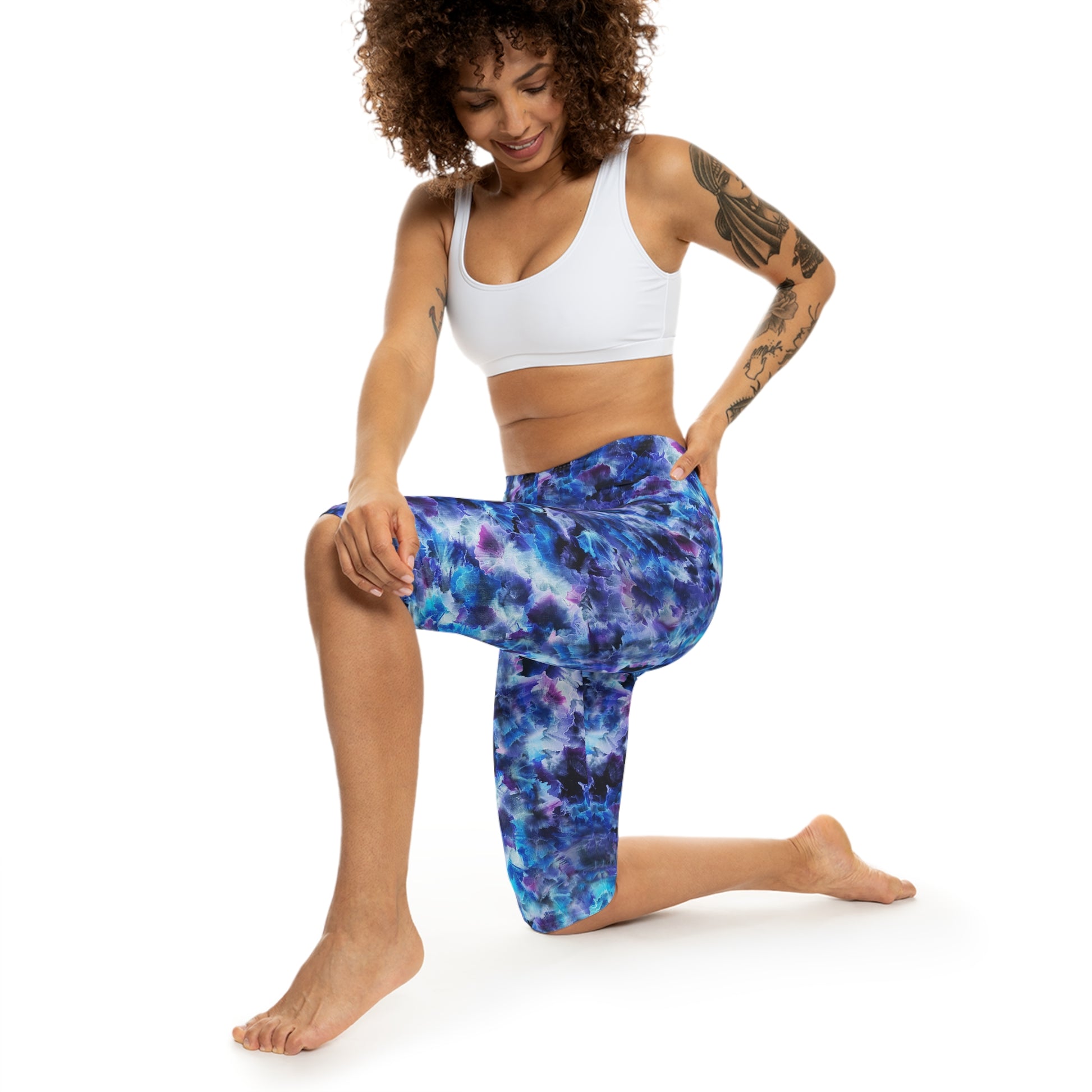 Model wearing Cosmos Capri Leggings by Alisa Marie – Comfortable, stylish activewear featuring a vibrant dreamy design in blue and purple hues.