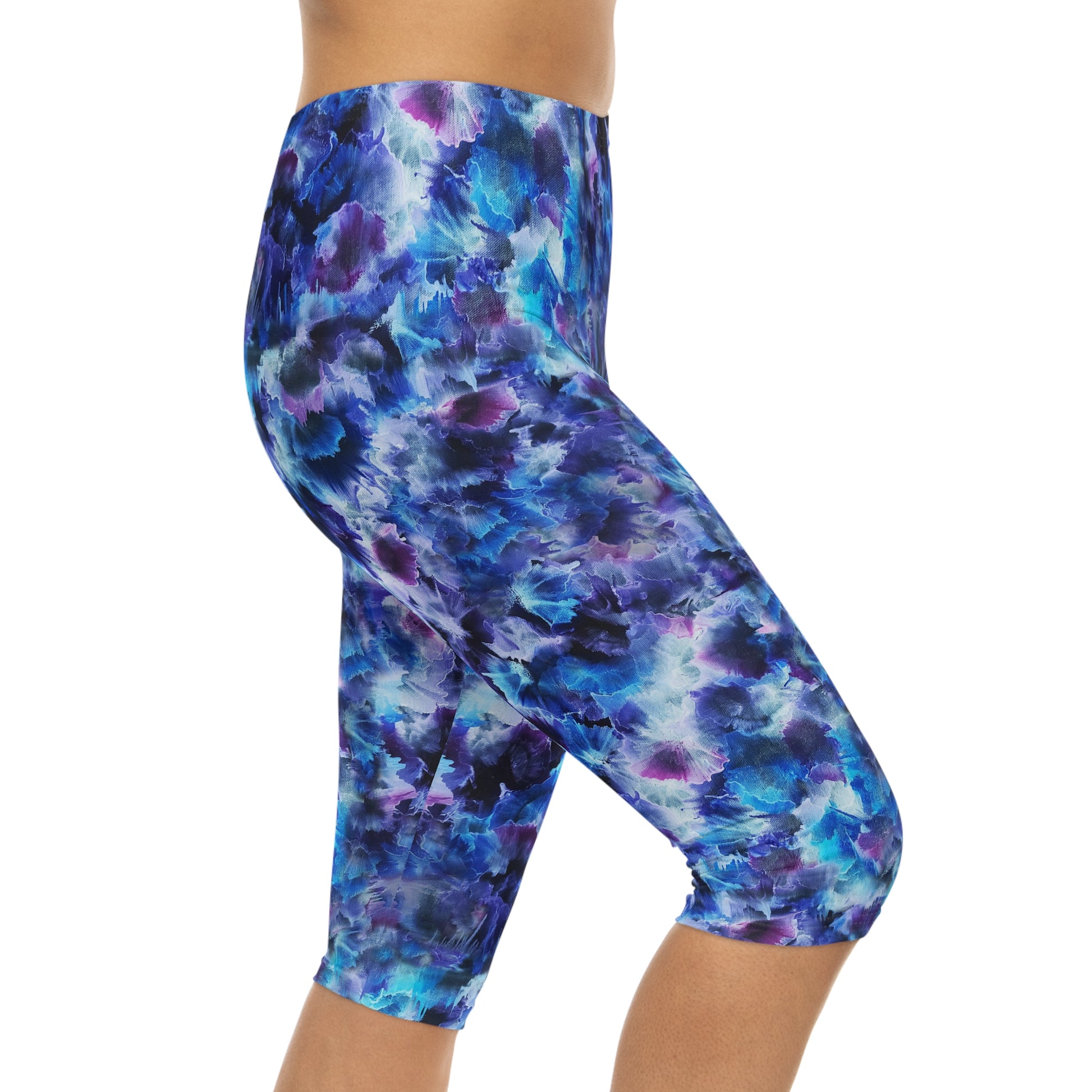 Side view of Cosmos Capri Leggings – Comfortable, stylish activewear featuring a vibrant dreamy design in blue and purple hues.