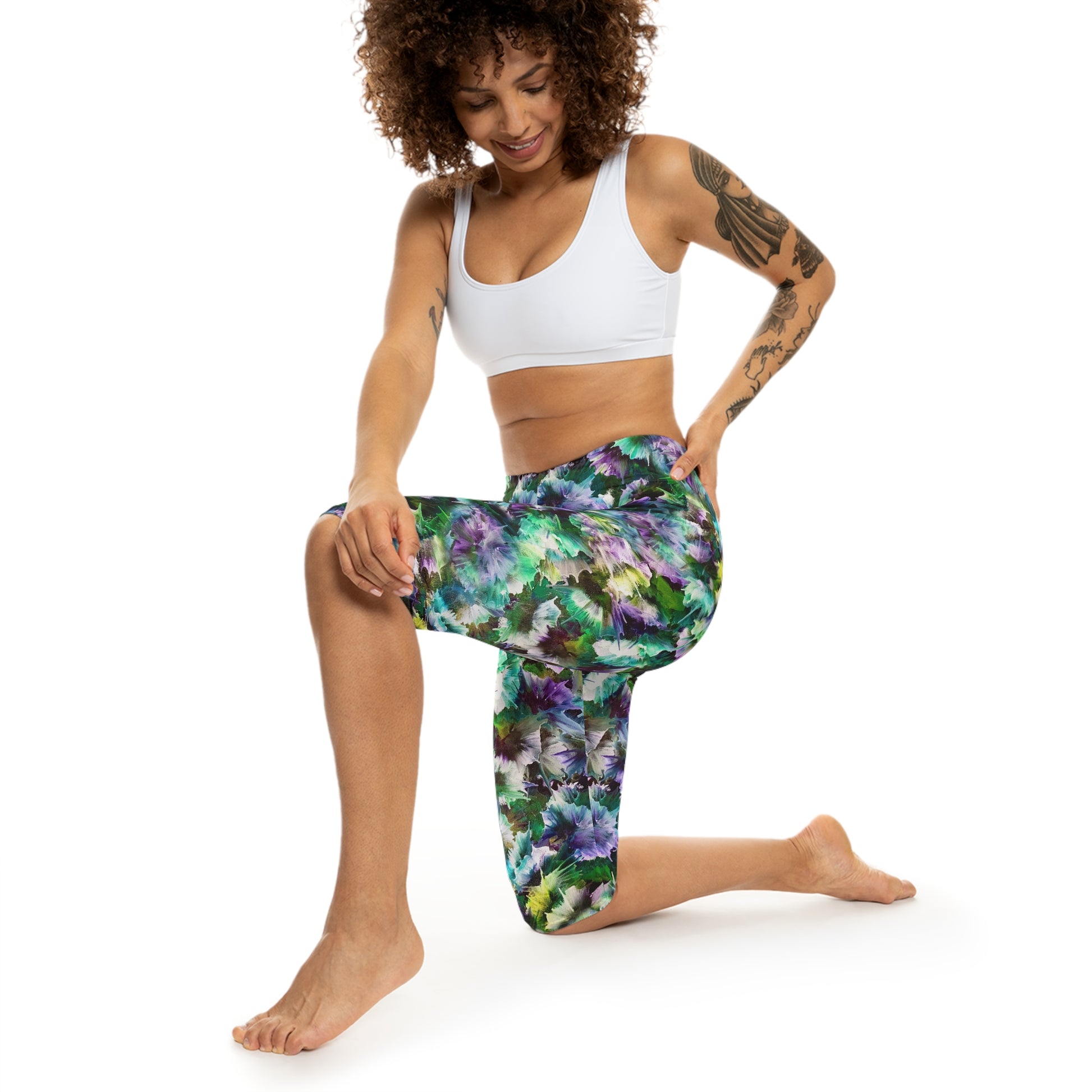 Model wearing northern Lights capri Leggings, by Alisa Marie. Activewear for yoga fitness, and casual wear with a vibrant, dynamic design.