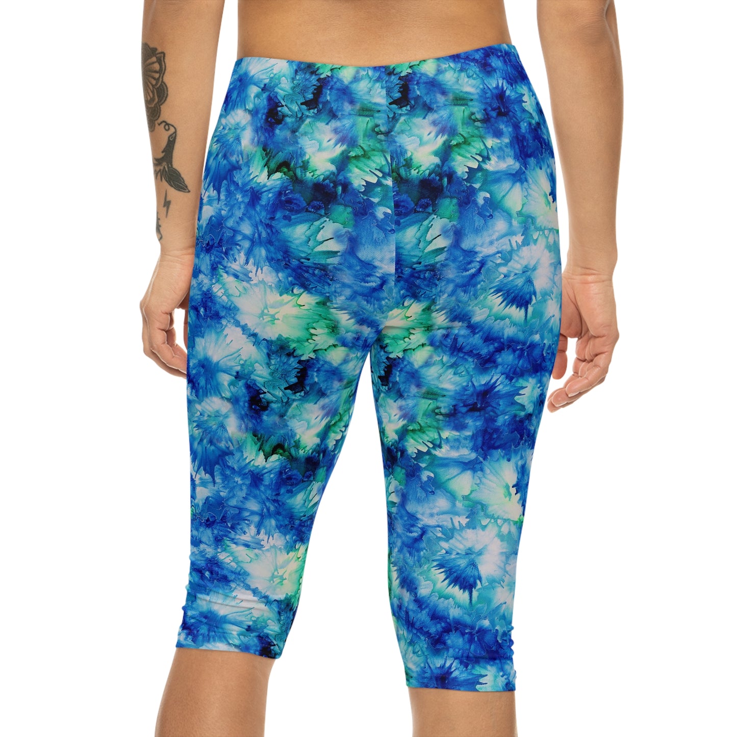 Back view of Ocean Mist Capri Leggings by Alisa Marie. The Coastal Blue design is perfect for yoga, fitness, or casual outings.