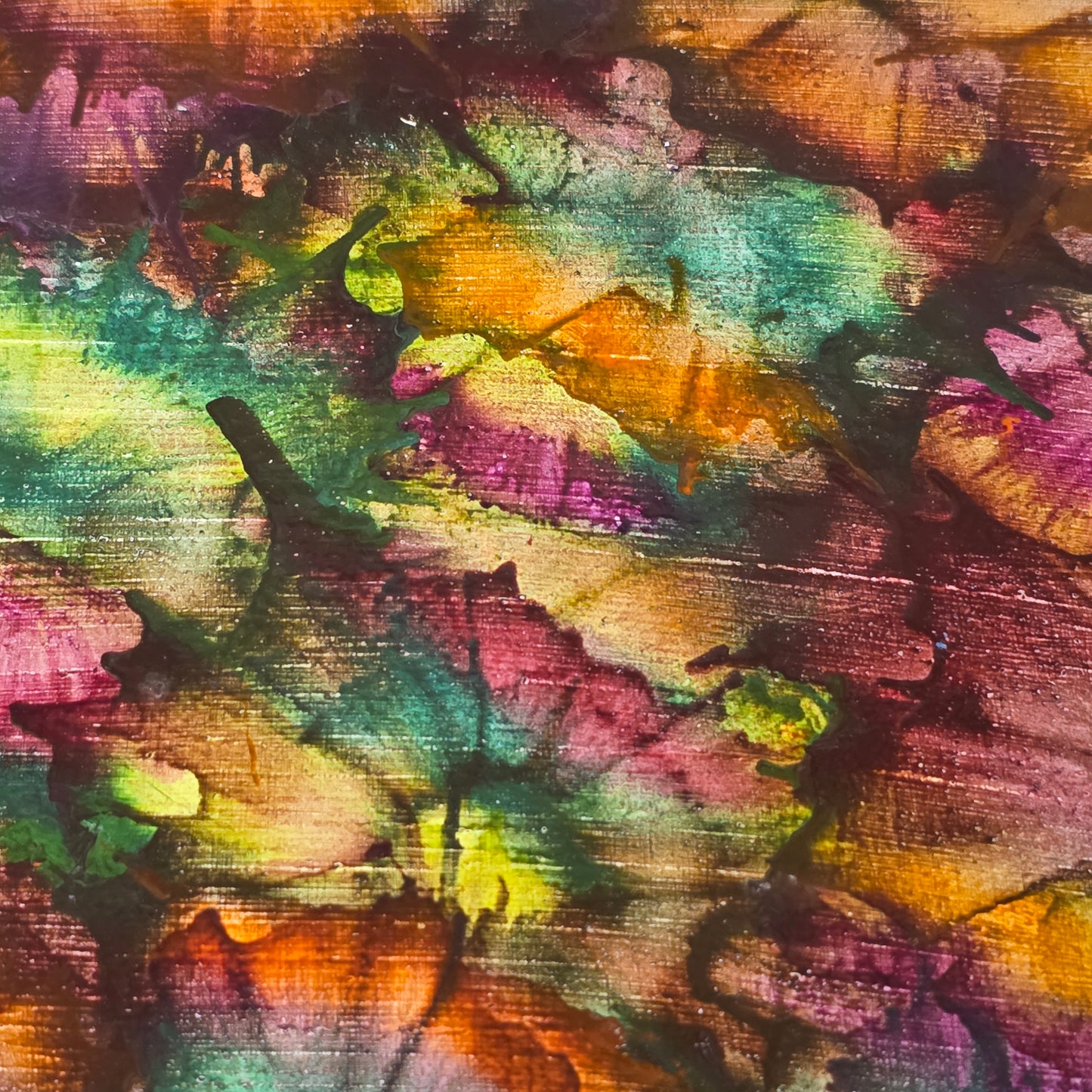 Abstract art with multicolored brush strokes on a textured surface