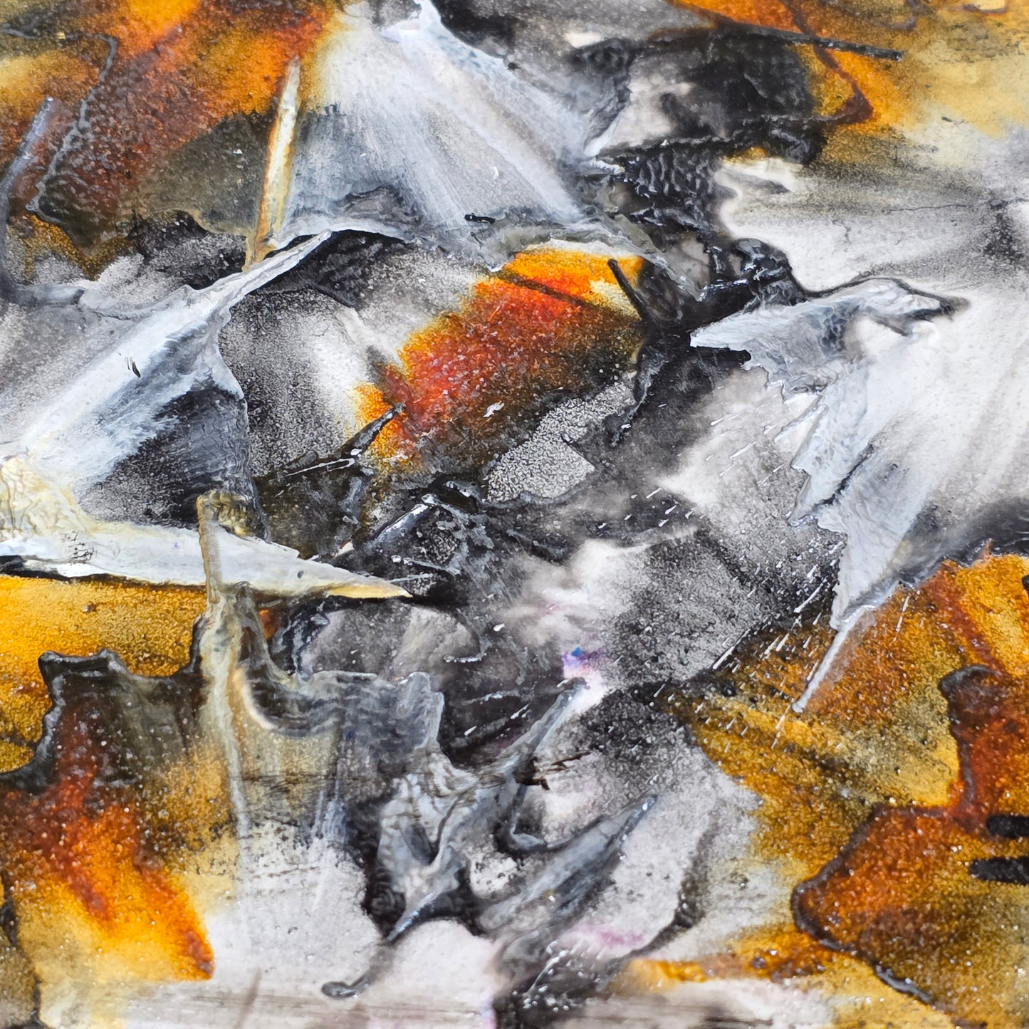 Abstract art with a mix of black, white, and orange colors.