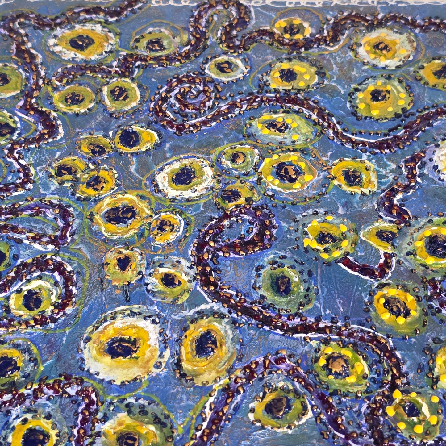 Encasutic abstract artwork with yellow and green circles on a blue background