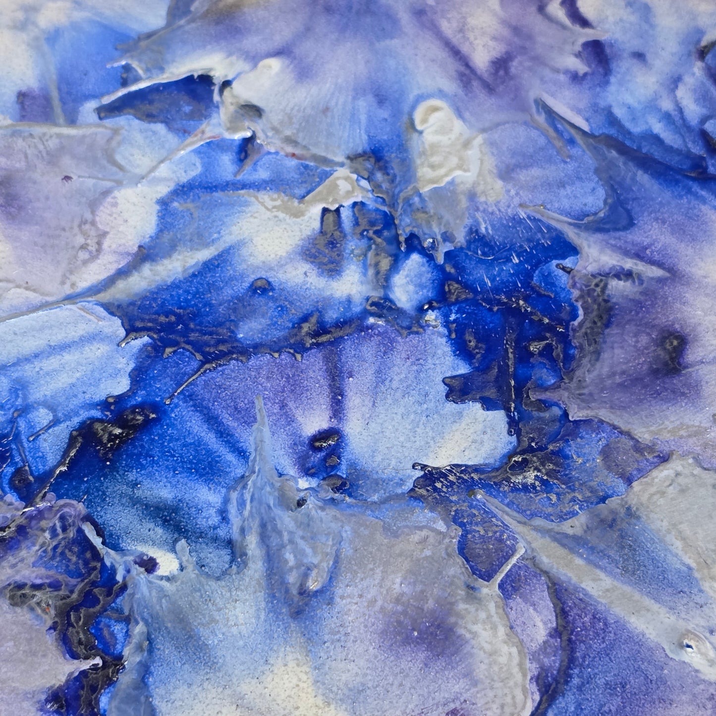 Abstract encaustic painting in blue and white tones