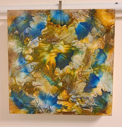 Alisa Marie original encaustic artwork, 'Bahama Dreams' featuring vibrant blue and golden tones flowing together in dynamic patterns, creating luminous movement across the wood.