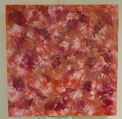 Alisa Marie original encaustic artwork 'Springtime Cherry Blossoms' featuring vibrant pink and coral tones with golden accents creating a floral burst pattern.